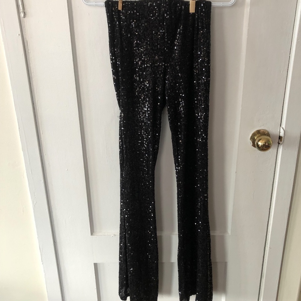 Forever 21 size exsmall  black sequinned pants, wide bell bottoms, elastic waist